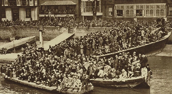 Spectators watching the Boat Race from barges on the Thames (b  /  w photo)