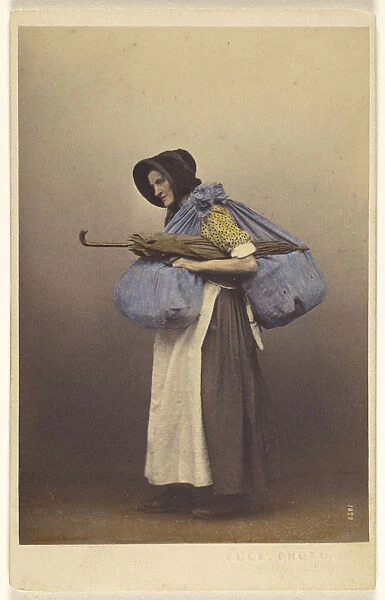 elderly woman wearing bonnet native costume standing