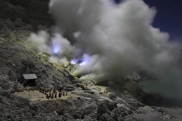 Burning sulphur in mining area on Kawah Ijen Volcano, Java, Indonesia