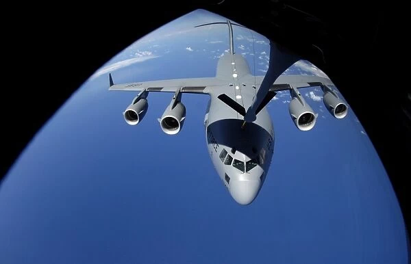 A C-17 Globemaster III receives fuel from a KC-135 Stratotanker