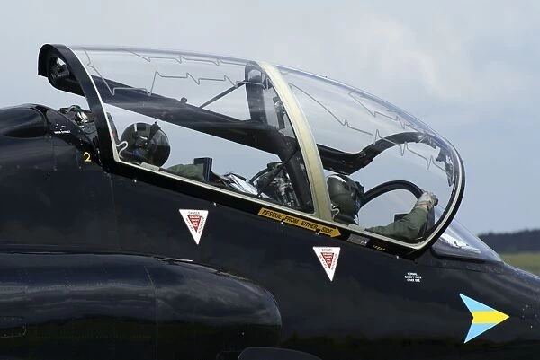 Pilots in the cockpit of a BAE Hawk T1 aircraft of the Royal Air Force