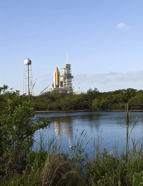 Space Shuttle Atlantis sits ready on the launch pad