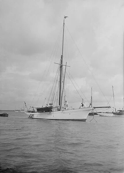 The cutter Yolande at anchor, 1912. Creator: Kirk & Sons of Cowes