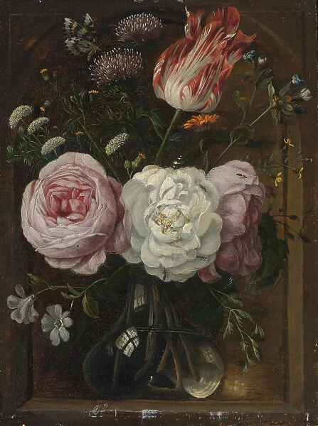Flower still life with a tulip and roses in a glass vase