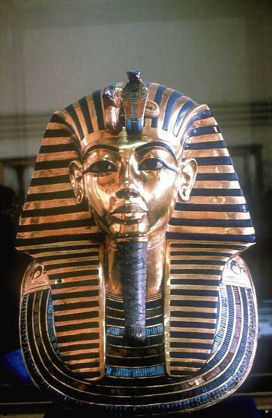 Gold mask of Tutankhamun on his mummy-case