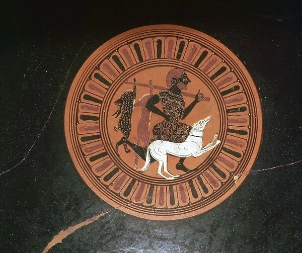 Detail of a Greek kylix showing a hunter and his dog
