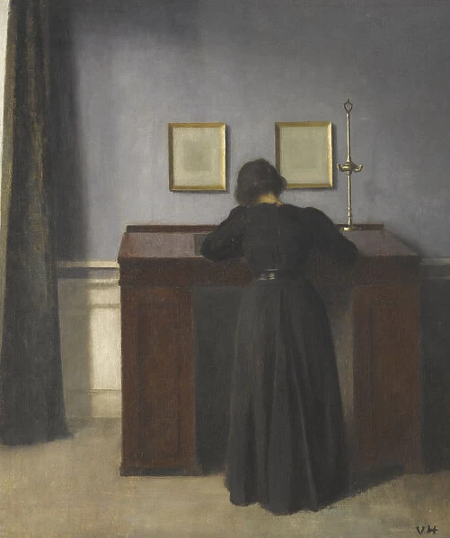 Ida Standing at a Desk. Artist: Hammershoi, Vilhelm (1864-1916)