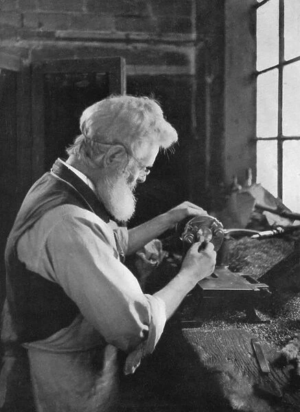 A watch cap maker at work, 1911-1912. Artist: AL Hitchin