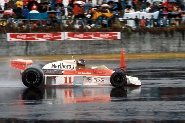 Formula One World Championship: James Hunt McLaren M23 overcame the terrible race conditions and a puncture late in the race to take third position