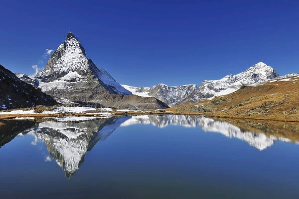 Matterhorn reflected in Lake Riffelsee, Zermatt, Alps, Valais, Switzerland