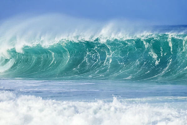 Ocean wave cresting before reaching the shore on Oahu, Hawaii, USA