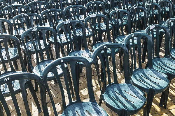 Plastic Green Chairs Lined Up In Rows; Malaga Province, Andalusia, Spain