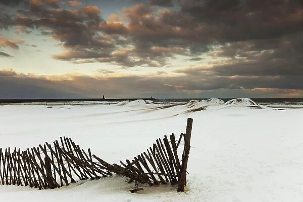 South Shields, Tyne And Wear, England; A Broken Fence In A Snow-Covered Field