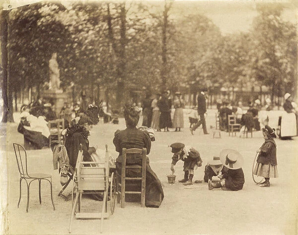Women and children in the Luxembourg Gardens, Paris, France circa 1898 by Eugene Atget. Eugene Atget, full name Jean-Eugene-Auguste Atget, 1857 - 1927. French photographer, famed for his decades long work to document the architecture and aura of Paris before all was lost to modernisation