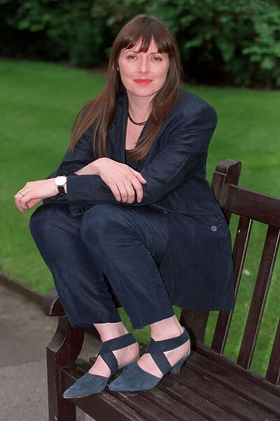 Carol Vorderman TV Presenter June 1997 Sitting on park bench A©mirrorpix