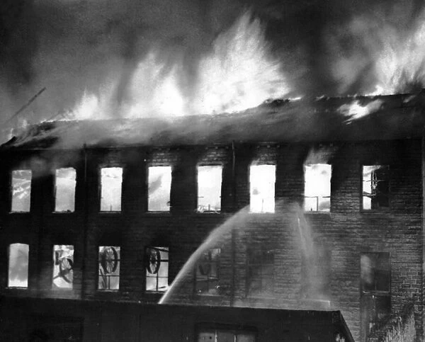 Flames leap from the roof of the mill during the height of the fire at Keighley, Bradford