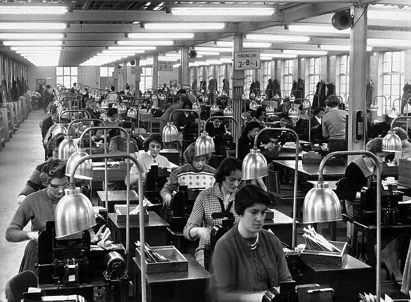 General picture of a Civil service office where girls operate machines that record names