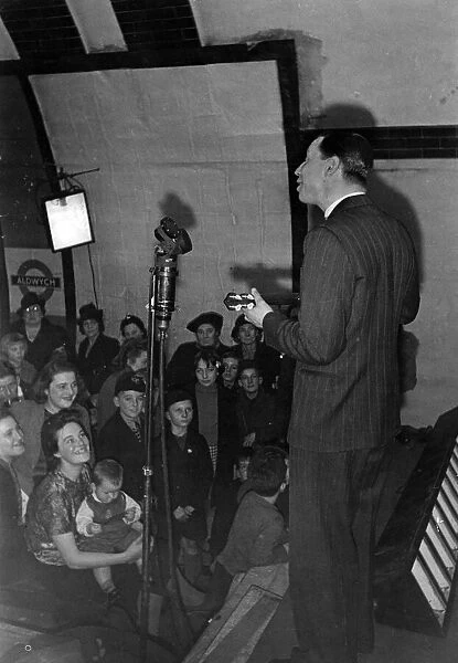 George Formby taking part in variety entertainment at Aldwych tube station. November 1940