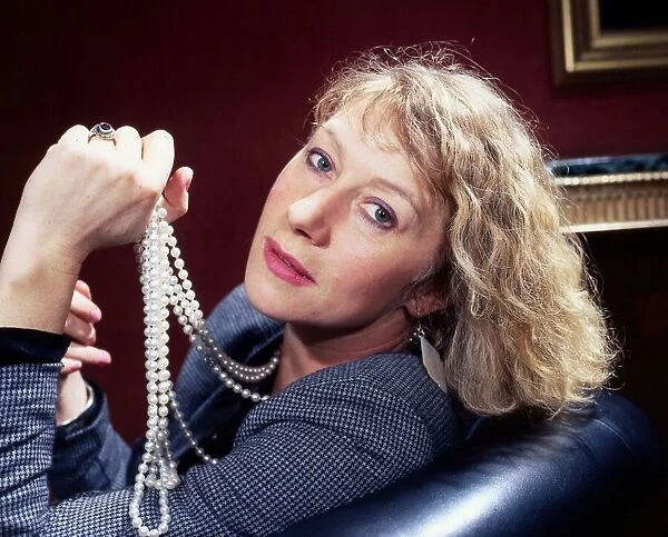 Helen Mirren holding pearls in hand May 1986