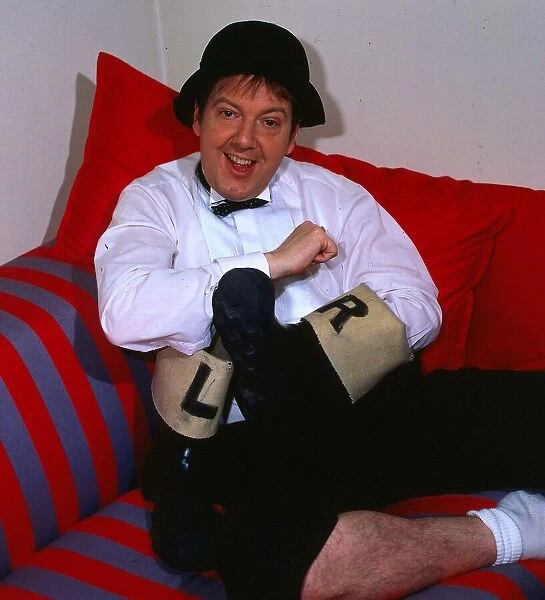 Jimmy Cricket comedian September 1986 holding left and right wellies welly boots