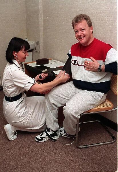 Keith Chegwin TV presenter at health farm January 1994 blood pressure being taken