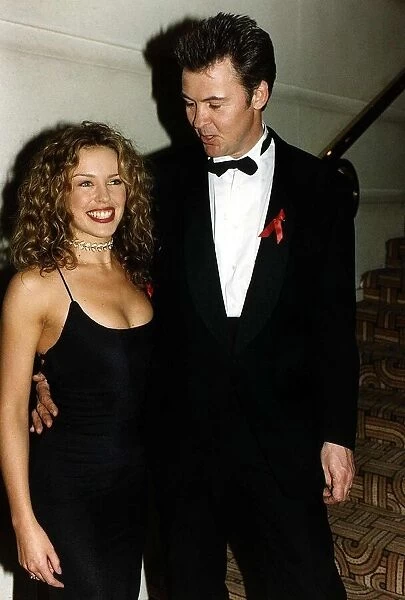 Kylie Minogue Australian singer and Actress with singer Paul Young Showing cleavage