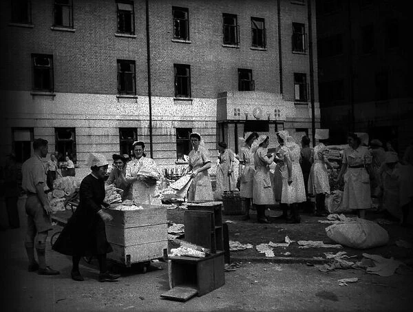 Lewisham Hospital after air Raid during WW2 1944 with nurses collecting some