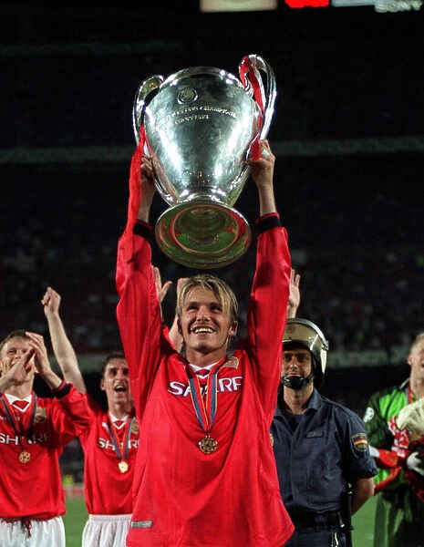 Manchester United player David Beckham May 1999 with the Champions League Cup trophy