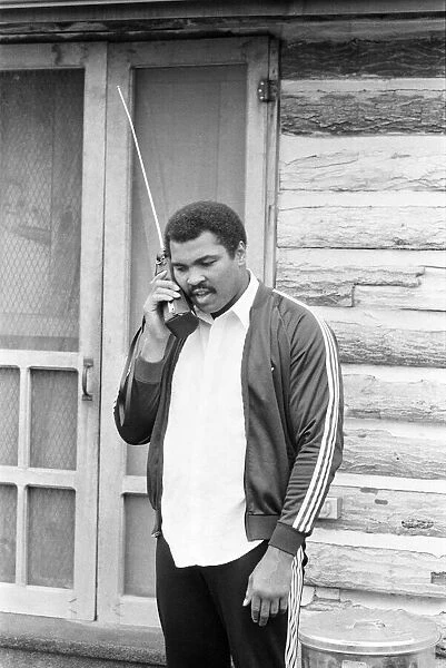 Muhammad Ali keeps in touch with friends and family from his training camp. 2nd May 1980