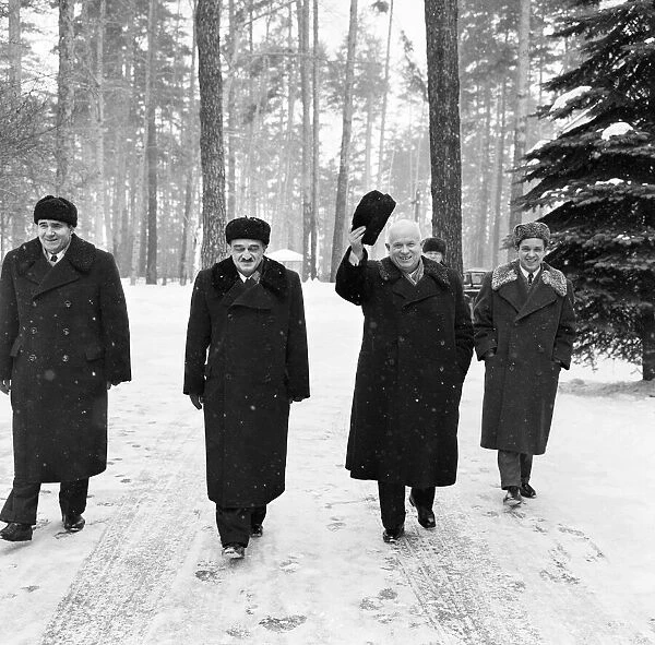 Nikita Khrushchev Soviet Leader pictured waving his hat as he walks in the snow with