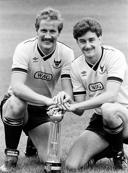 Oxford United footballer John Aldridge (right) with teammate hold the Second Division