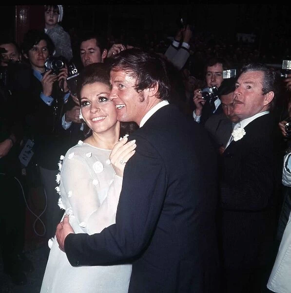 Roger Moore Actor with his bride Luisa Mattioli after their wedding ceremony with their