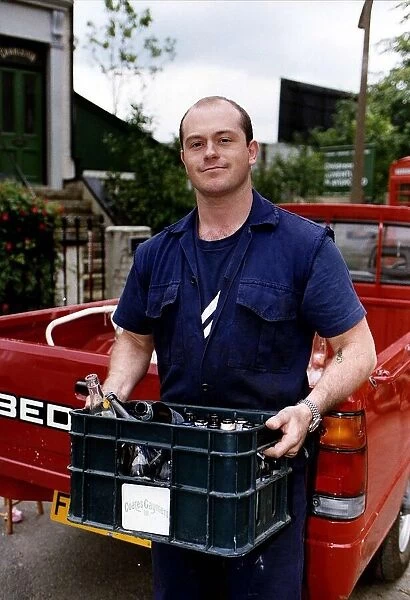 Ross Kemp Actor of Eastenders on the Set with a Crate of empty Beer Bottles