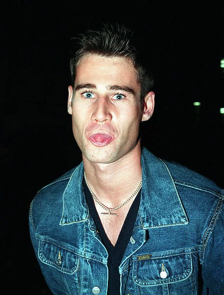 TIM VINCENT TV PRESENTER September 1998 Sticking tongue out at camera denim jacket