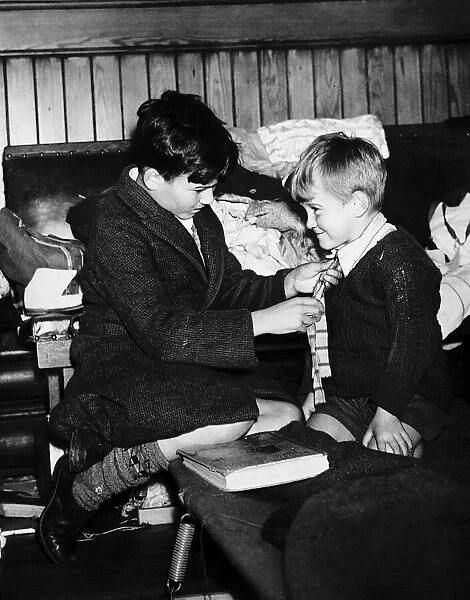 World War Two 1940 Evacuee boy gets a helping hand from his elder brother