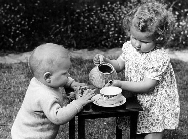 Young girl and boy having tea party. c. 1945 P044477