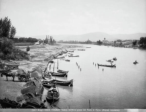 View of the River Arno taken by the iron bridge (now Bridge St. Nicholas) with sand diggers at work, Florence