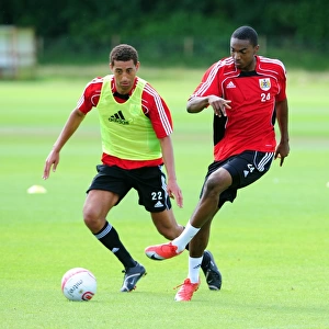 Bristol Citys Marlon Jackson battles for the ball with Bristol Citys Lewin Nyatanga
