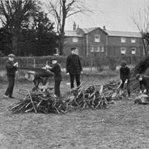 Boys chop wood, NIPRCC East Harling, Norfolk