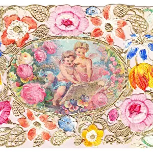 Cherubs with flowers on a paper lace greetings card