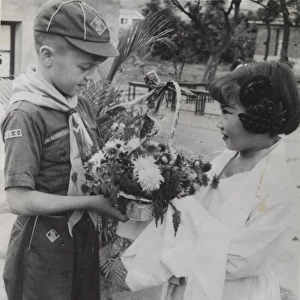 Cub Scout receiving flowers, Taipei, Formosa