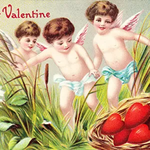 Cupids with red hearts on a Valentine postcard