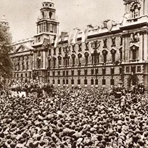 An estimated crowd of 60, 000 waiting in Parliament Square on VE Day for Prime Minister