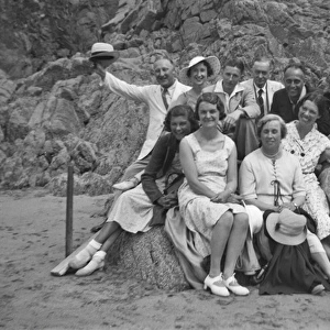 Group photo of people relaxing on a beach