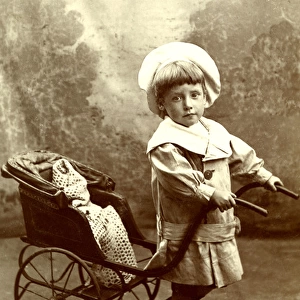 Little boy with a toy rickshaw