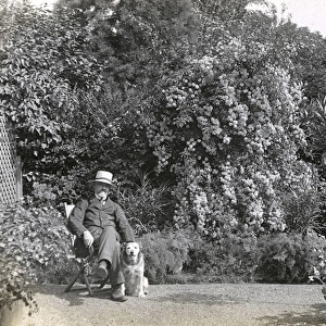 Man in deckchair with pet dog
