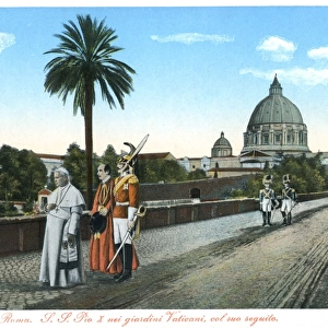 Pope Pius X walks in the Vatican City with Papal Swiss Guard
