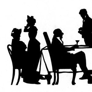 Silhouette of diners and waiters at a table