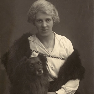 Studio portrait, woman with dog