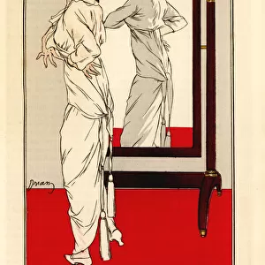Woman in linen dress looking at herself in the mirror